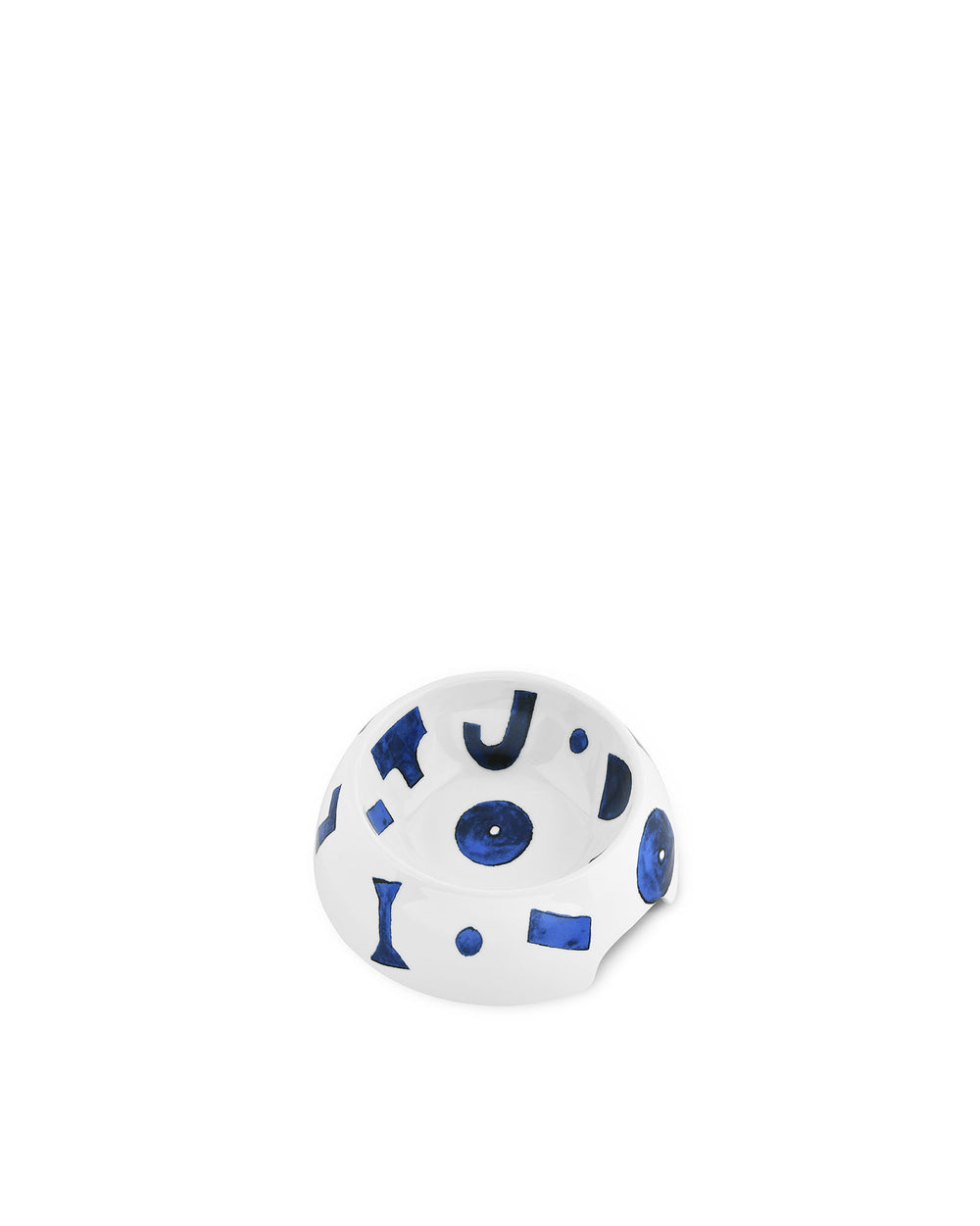 White ceramic dog bowl by Alessi, decorated with abstract blue letter-like and circular patterns.