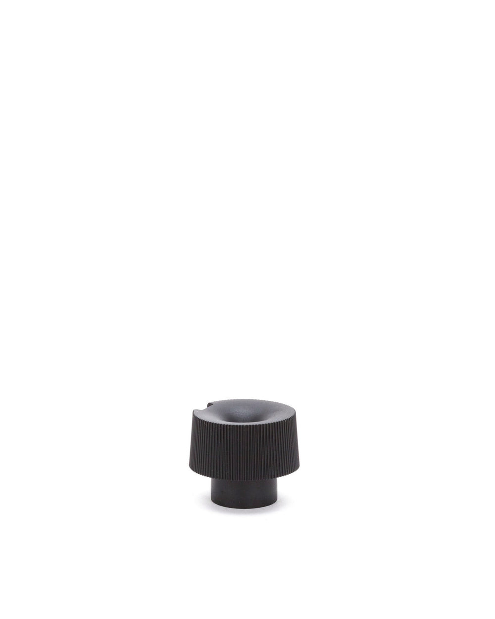 Black knob-like spare part by Alessi with vertical ridges and a concave top.