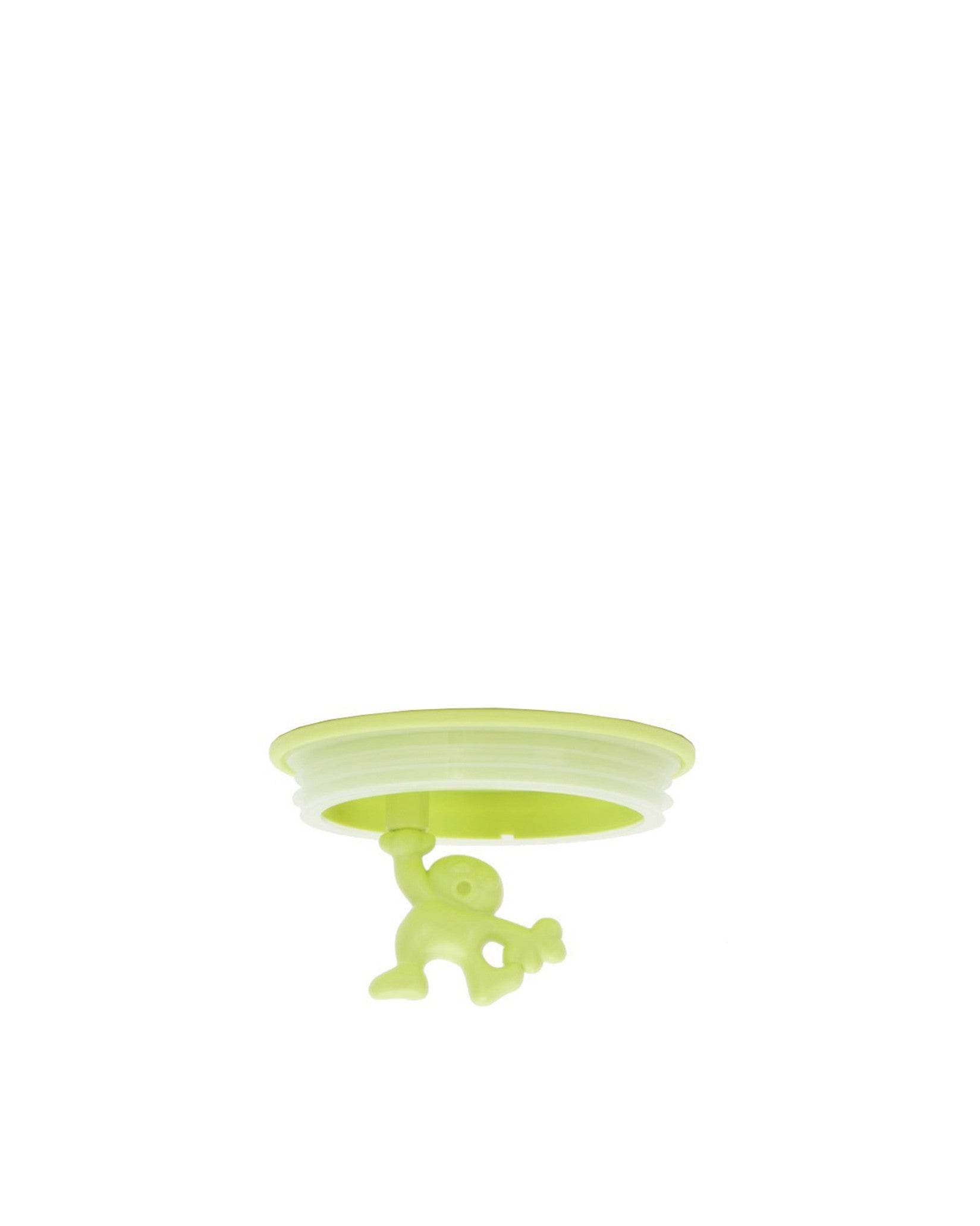 Light green stopper spare part by Alessi with a small humanoid figure hanging underneath.
