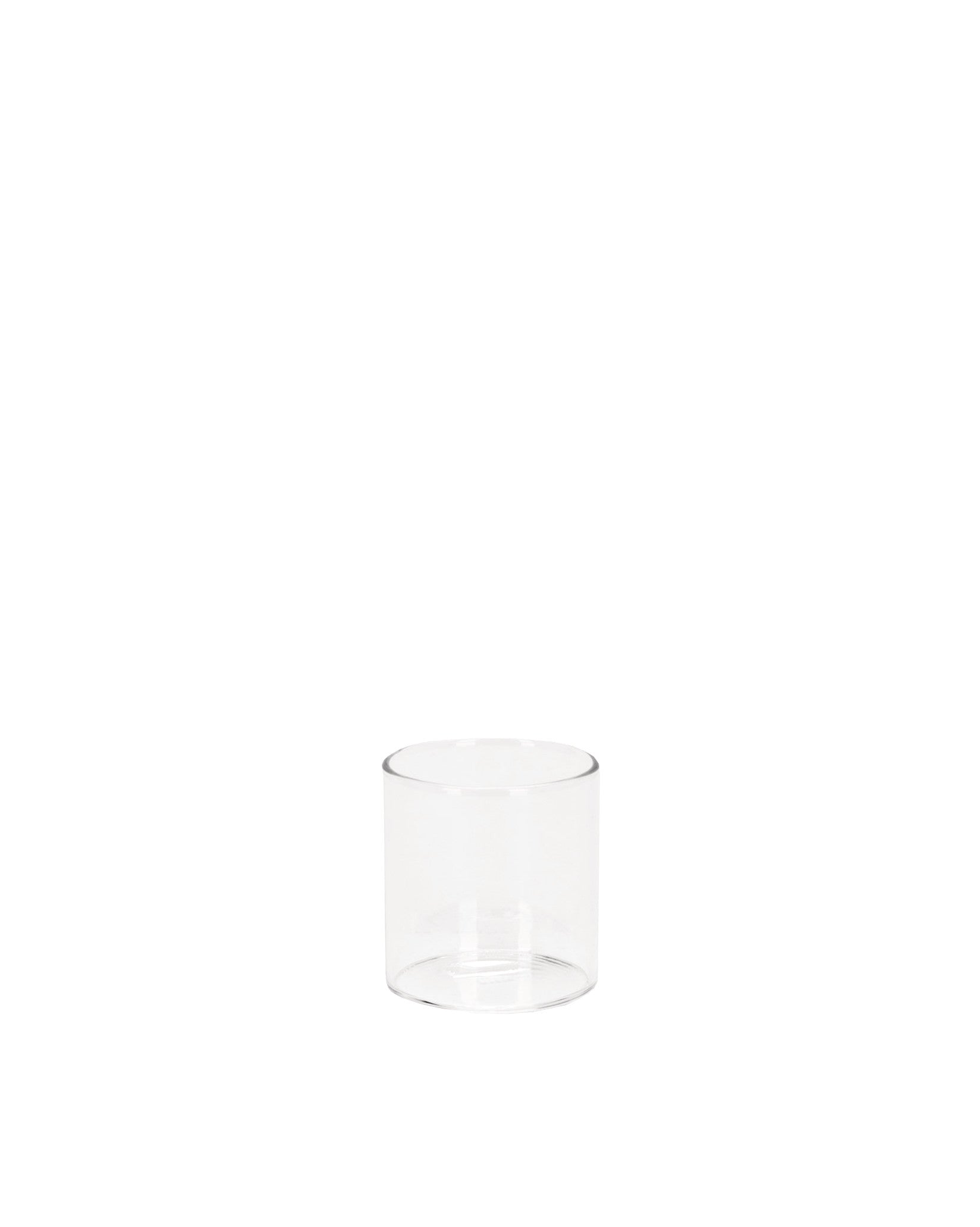 A clear cylindrical glass spare part by Alessi, standing upright on a white background.
