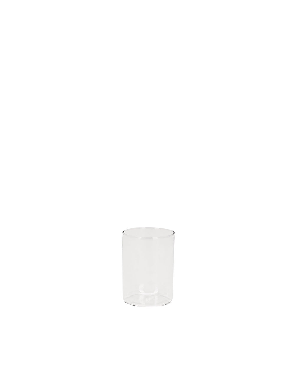 Clear cylindrical glass spare part by Alessi, empty and transparent.