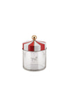 Clear glass jar with a red and white striped lid by Alessi, featuring a gold knob and etched carousel horse designs.
